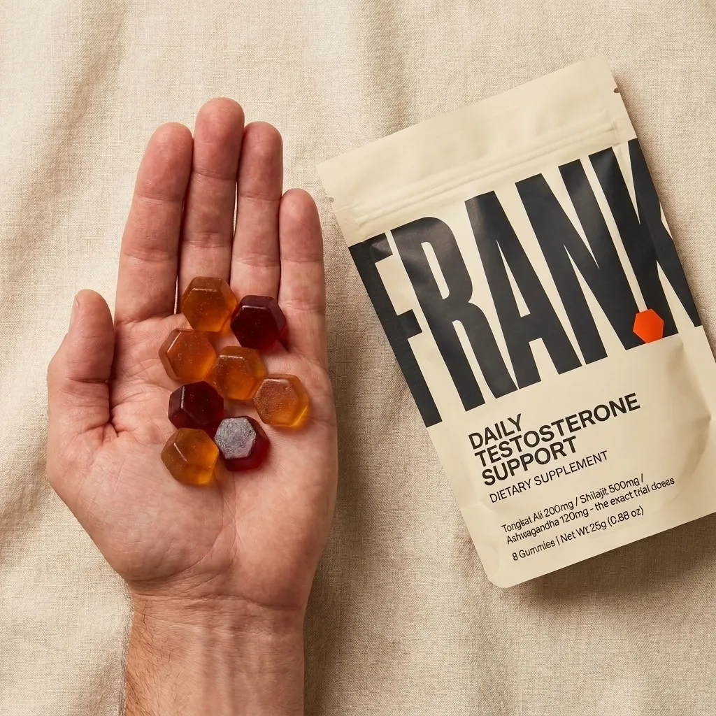 A day of Frank: 8 hexagon gummies in an open palm beside the pouch